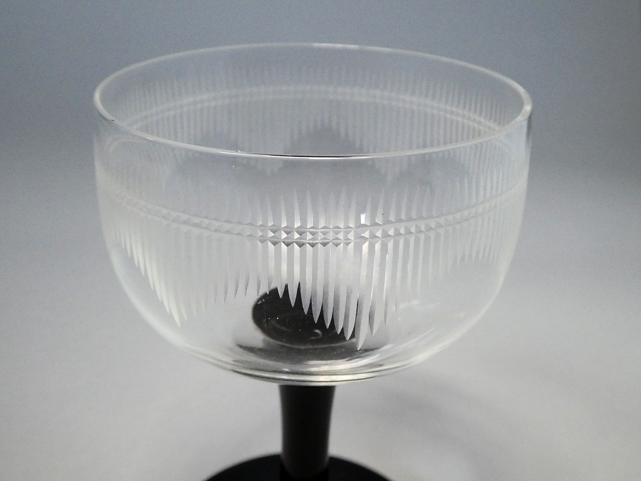 Black stem cut glass glass